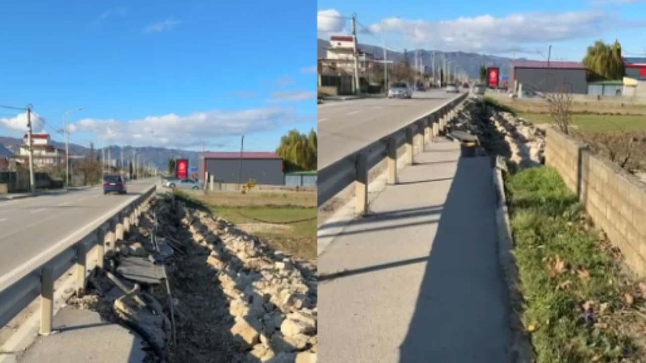 Shembet një pjesë e trotuarit në aksin Pogradec Qafë Plloçë  dëmtohen rrjetet nëntokësore  rrezikohet jeta e këmbësorëve